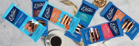 Edward's chocolate bars on a table with a cup of coffee.