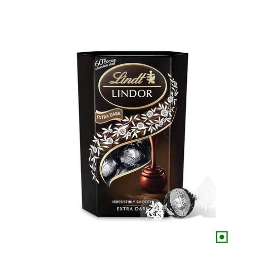 A box of Lindt Lindor Chocolate Cornet 60% Dark 200g, featuring an elegant design with white floral patterns on a black background. Two unwrapped chocolates are displayed next to the box, showcasing the fine craftsmanship from Switzerland.