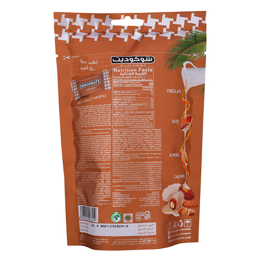 A bag with a packet of Chocodate Exclusive Real Caramel Pouch 100g, coconut, and Arabian Dates.