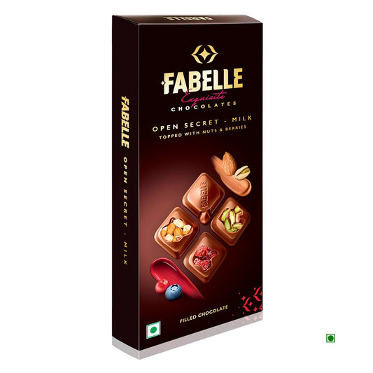 Fabelle's "Open Secret - Milk" chocolate bar, crafted in India, features chocolates adorned with nuts and berries.