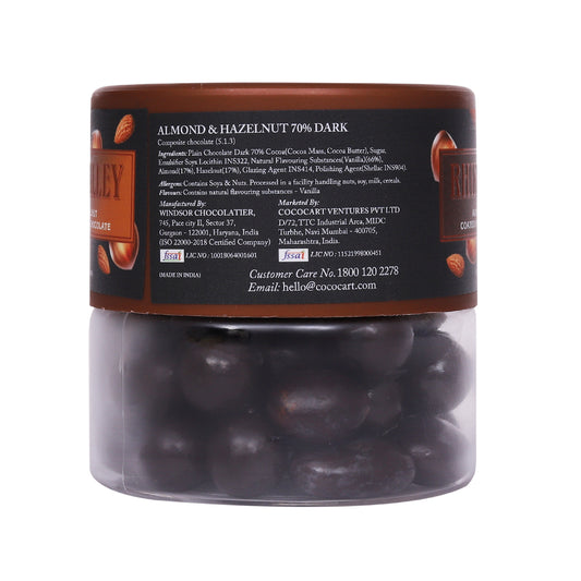 A jar of Rhine Valley Almond & Hazelnut 70% dark chocolate spread with label details including ingredients and company contact information. The spread features finely sourced Turkish Hazelnuts and Californian Almonds.