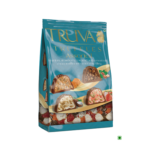 The Truva Truffle Quadro Assorted Bag 500g, in blue packaging, contains chocolate ganache pieces with illustrations of hazelnut, strawberry, caramel, and coconut flavors.