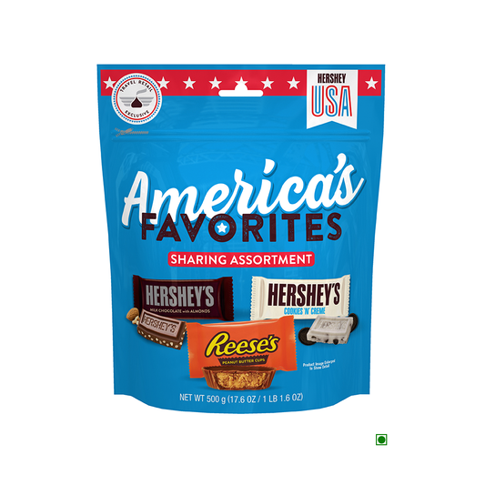 A blue package labeled "Hersheys Sharing Assorted Bag 500g" contains snack size chocolates, including REESE'S, HERSHEY'S Milk Chocolate with Almonds, and HERSHEY'S Cookies 'N' Creme candy. Net weight is 500g (17.6oz).