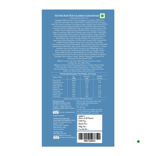 The back of the Rhine Valley Handcrafted Classics Milk Chocolate 275g box features detailed ingredients, nutritional information, and manufacturing details on a blue background. Enjoy the rich taste of milk chocolate crafted with care by Rhine Valley.