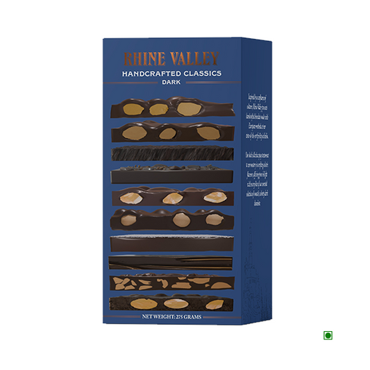 Assorted dark chocolate box featuring multiple rectangular pieces adorned with nuts, labeled "Rhine Valley Handcrafted Classics Dark Chocolate 275g," expertly crafted in India.
