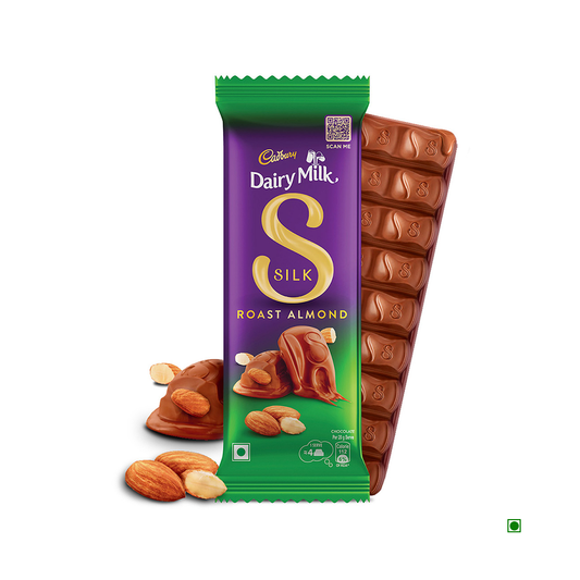 A Cadbury Dairy Milk Silk Roast Almond Chocolate Bar 58g, featuring creamy milk chocolate and crunchy almonds, with its packaging alongside a piece of chocolate.