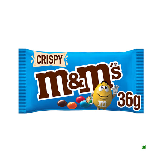 A 36g blue bag of M&M's Crispy with brown, orange, blue, and red candies features a waving yellow cartoon character in the lower right. Made in France.