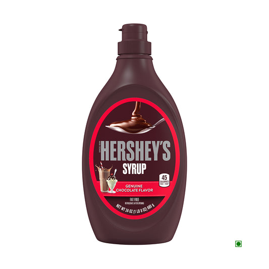 Hershey's Milk Chocolate Syrup Bottle 680g, crafted in the USA, showcases a red label with an image of syrup cascading into a milkshake.