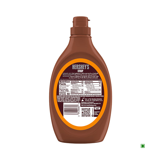 A brown plastic bottle of Hershey's Caramel Syrup 623g is shown, featuring its nutrition facts and ingredients label on the back, proudly made in the USA.