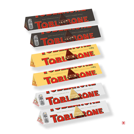 Six Toblerone Chocolates from the Combo Pack Gift Set (White, Dark, Milk; 100g each) by Toblerone are stacked horizontally on a white background.