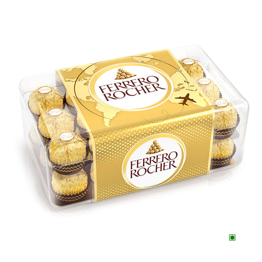 A clear plastic box holds 16 Ferrero Rocher T30 chocolates, each wrapped in gold foil with a hazelnut center and topped with a branded label. From the brand: Ferrero.