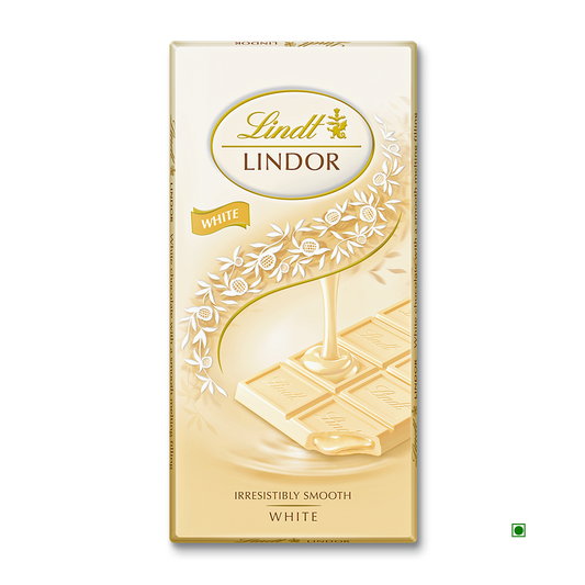 Lindt Lindor White Tablet 100g packaging by Lindt shows white chocolate poured over squares, adorned with floral designs and gold accents.