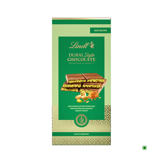 The Lindt Dubai Chocolate 145g bar is shown in green packaging with images of chocolate pieces, pistachios, and kadaifi pastry.