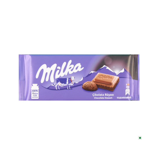 Milka Chocolate Dessert Bar 100g by Milka comes in purple packaging with a cow, mountain graphic, and bilingual text. Made with smooth alpine milk and rich cocoa cream for an irresistible treat.