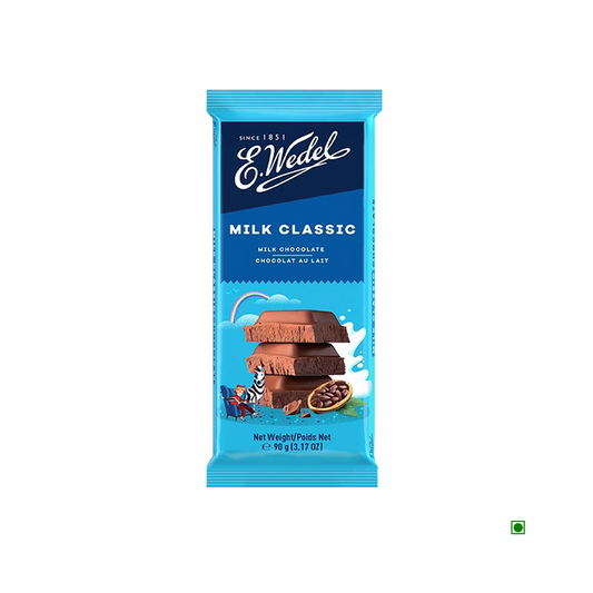 A Wedel Milk Chocolate Bar 90g with milk and fruit on it.