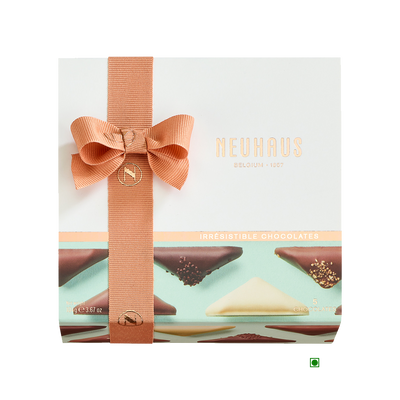 A box of Neuhaus Discovery Irresistibles 104g chocolates with a bow on top.