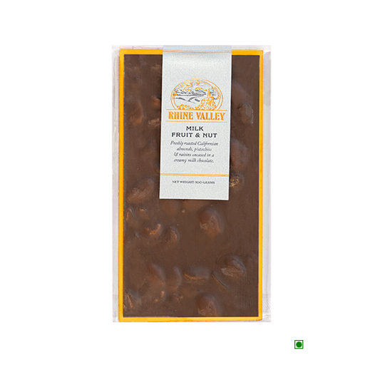 A decadent bar of Rhine Valley Milk Fruit & Nut Bar 100g adorned with a label and sprinkled with a generous scattering of Iranian pistachios and Californian almonds.