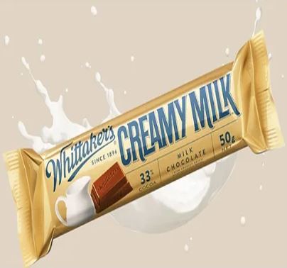 A Whittaker's Creamy Milk Bar 50g with a splash of milk.