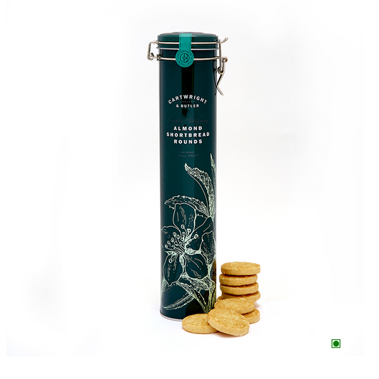 A tin of Cartwright & Butler Almond Shortbread Rounds next to a white background.