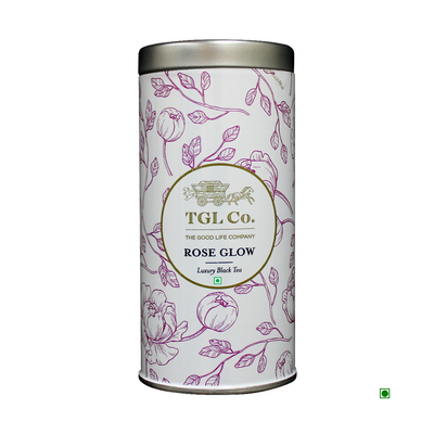 Cylindrical tea tin with a floral design and the label "Cococart India Rose Glow Black Tea 35g with rose petals" on a white background.