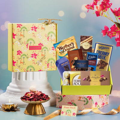 A Premium Pink Festive Giftbox from Gift Hampers filled with chocolates and flowers from the Diwali collection.