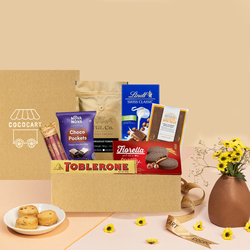 Gift Hampers offers a delightful Magic Moments Giftbox, filled with delectable chocolates, scrumptious cookies, and beautiful flowers.