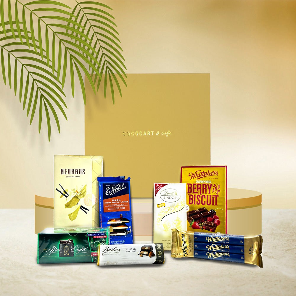 An assortment of After Eight Mint Chocolate Thins and other chocolates is displayed with a golden box labeled "Cheers to Happiness Gift Box" by Gift Hampers.