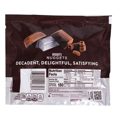 Back of a Hershey's Nuggets Milk Chocolate Bag with nutrition facts and a clear view of chocolate pieces.