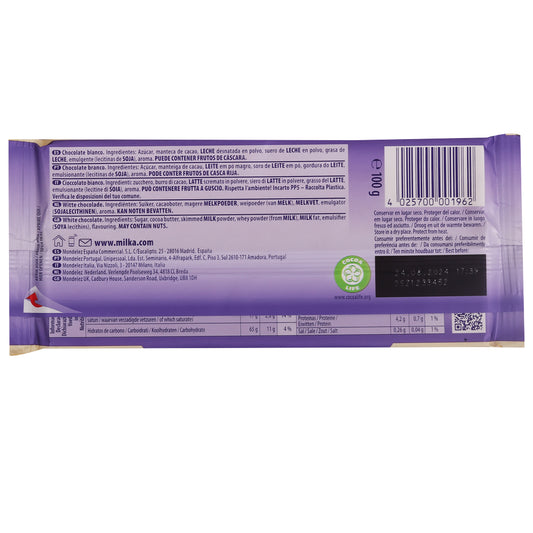 Back view of a Milka White Bar 100g showing ingredients, nutritional information, barcode, and manufacturing details in multiple languages on a purple wrapper, highlighting the alpine milk that contributes to its creamy goodness.