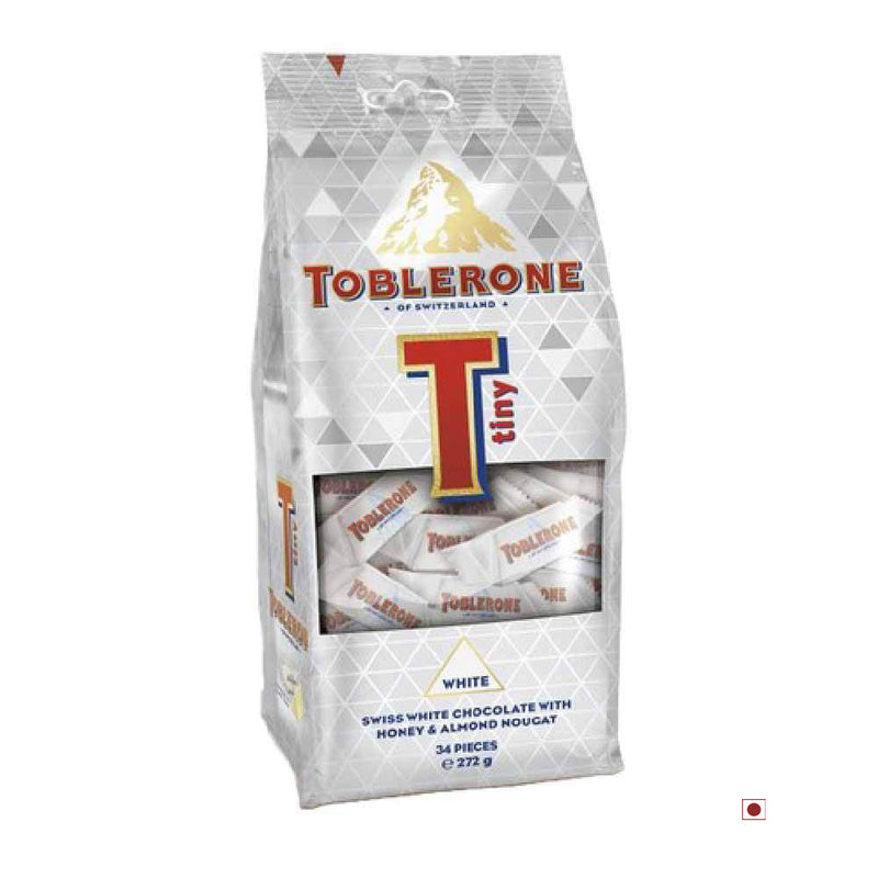 An individually wrapped bag of Toblerone Tiny White Bag 272g on a white background.