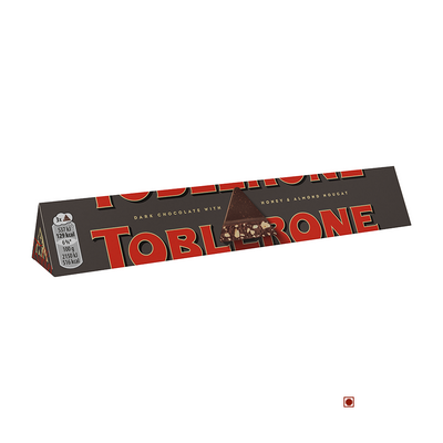 A triangular Toblerone Dark Bar 100g with the word Toblerone on it, proudly made in Switzerland.