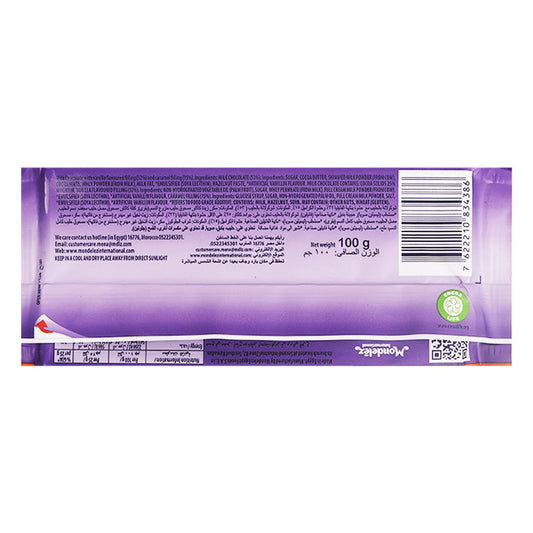 The image shows the back of a Milka Caramel Milk Chocolate Bar 100g wrapper with text detailing nutritional information and ingredients. The wrapper is primarily purple with a barcode on the right side, hinting at the creamy caramel and milk chocolate goodness inside.