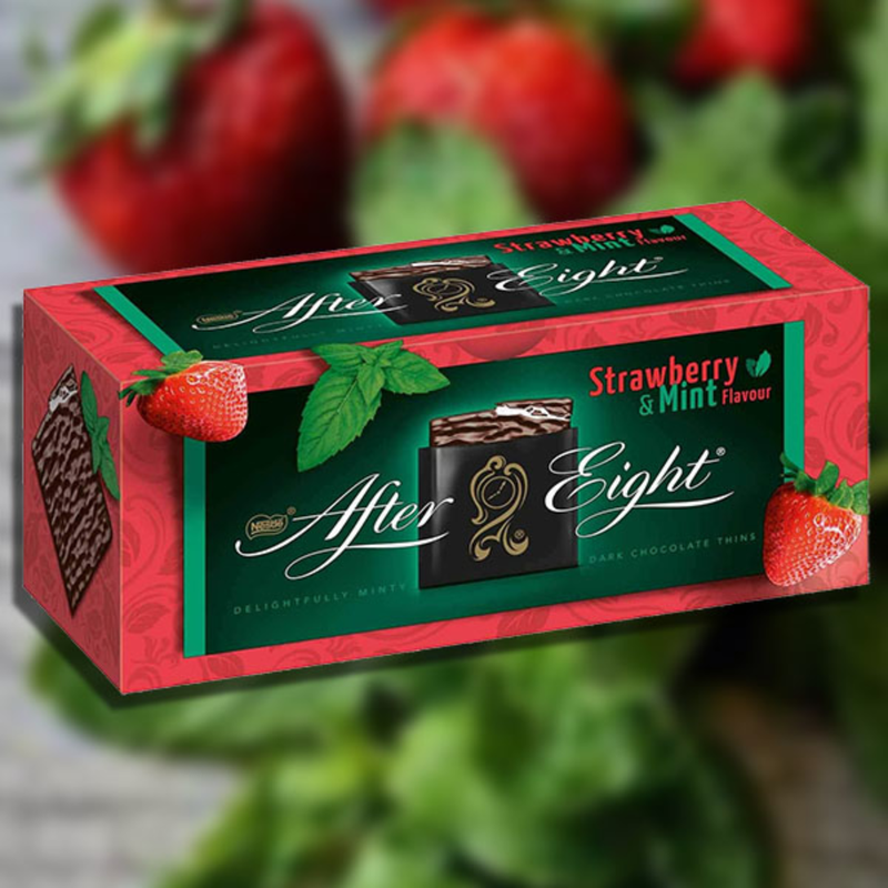 An After Eight Strawberry Mint Chocolate Thins Box 200g with strawberries and mint.