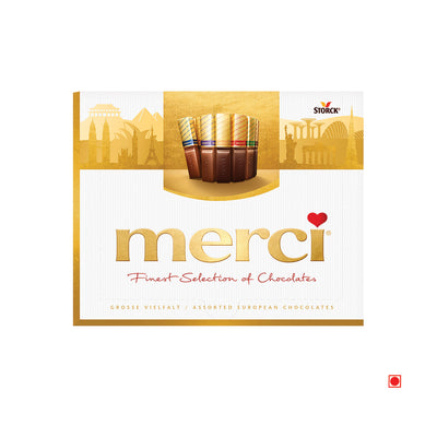 Box of Merci Finest Selection Milk Chocolate 250g with a background featuring iconic skyline silhouettes.