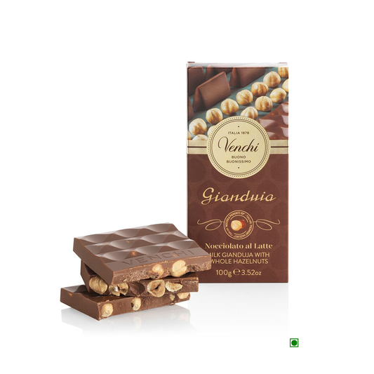 A Venchi Milk Gianduia Hazelnut Bar 100g with nuts and a box.