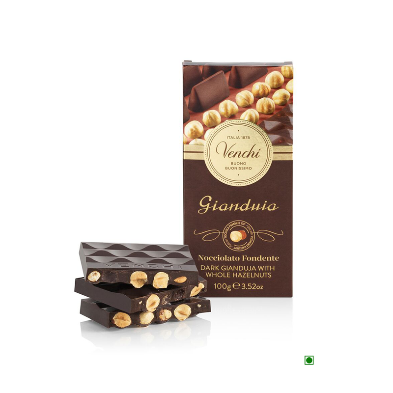 A box of Venchi chocolates with a Venchi Dark Gianduia Hazelnut Bar 100g on top.