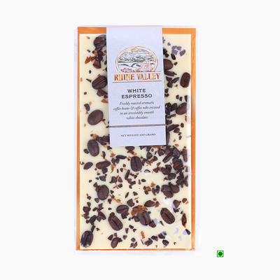 A Rhine Valley White Espresso 100g chocolate bar with chocolate chips, nuts, and cacao nibs.