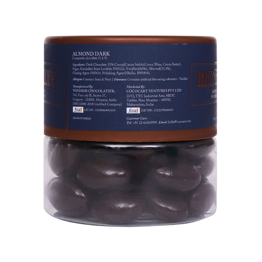 Clear glass jar containing Rhine Valley Almond Dark Dragees 120g made with Californian almonds, labeled with ingredients and Rhine Valley brand information.