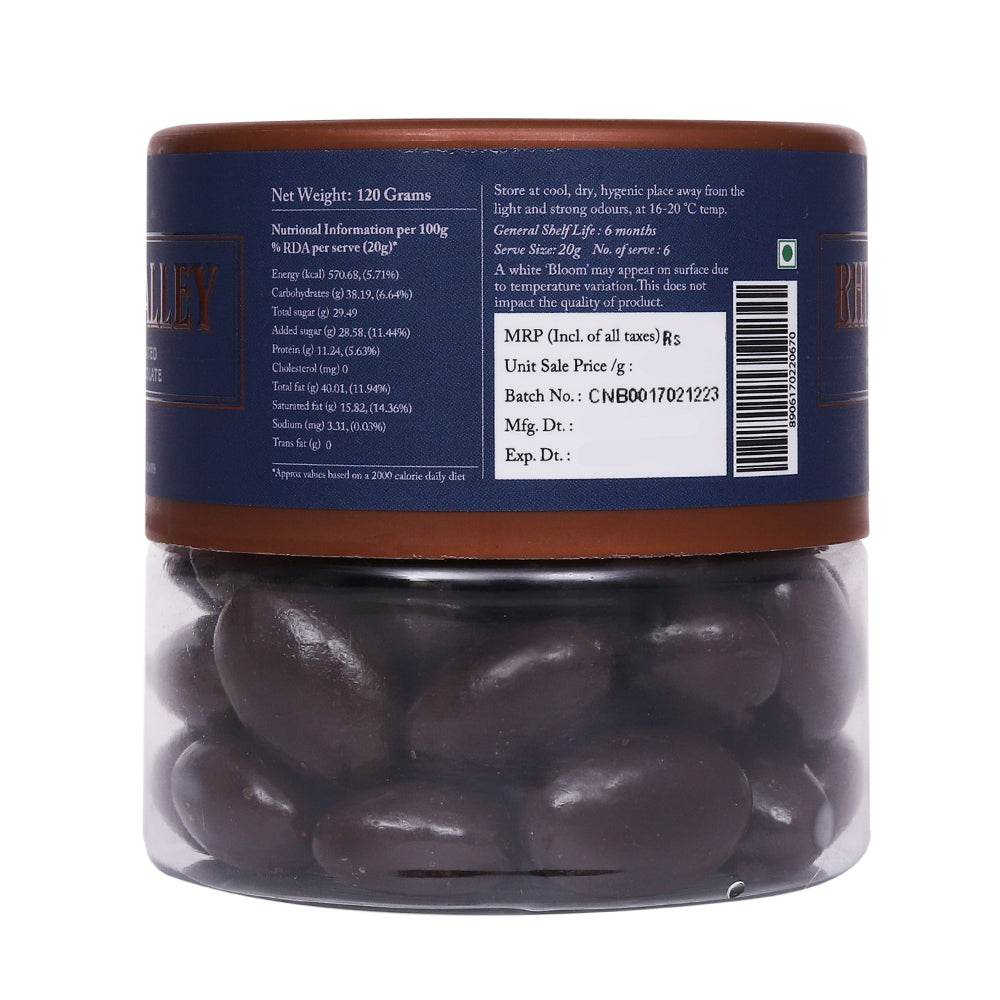 Transparent jar containing Rhine Valley Almond Dark Dragees 120g, displaying nutritional information and barcodes on the label.