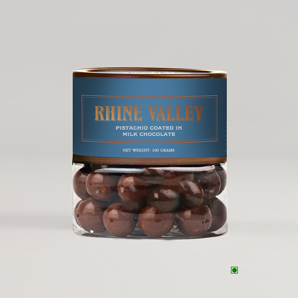 Creamy milk chocolate Rhine Valley Pistachio Milk Dragees 100g in a jar on a white background.