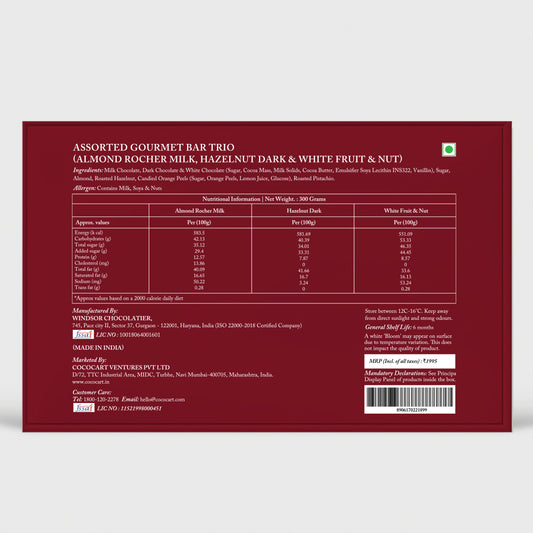 Label of a Rhine Valley Gourmet Chocolate Experience providing nutritional information, ingredients, and manufacturing details in white text on a maroon background for the Rhine Valley Milk, Dark & White Assorted Collection 300g gift box.