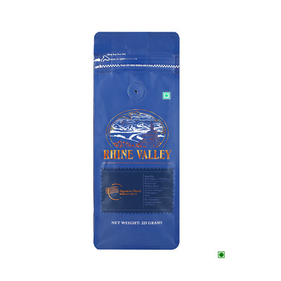 A bag of Rhine Valley Signature Blend Whole Bean 225g coffee with a blue label on it, featuring the SEO keywords "Signature Blend".