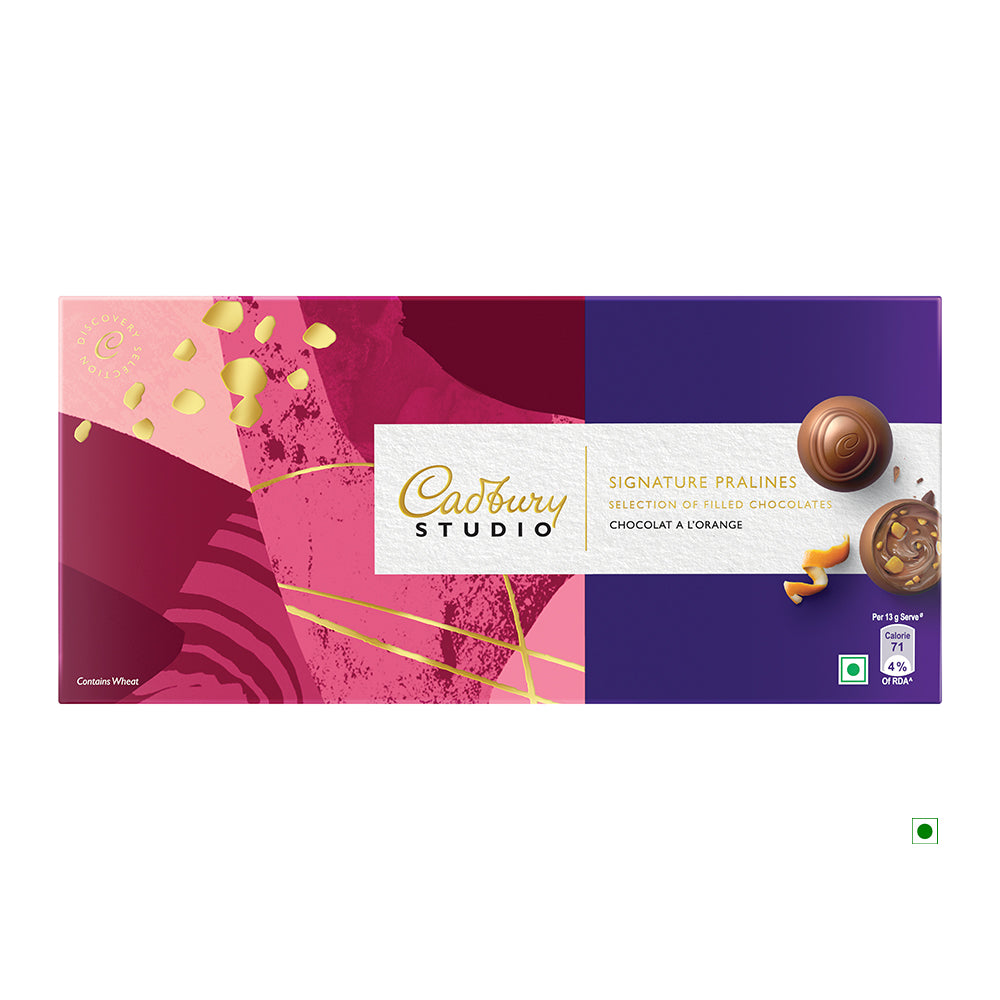 The Cadbury Orange 130g box, containing 10 pralines, features an abstract red and purple design embellished with tempting images of chocolates. Crafted in India, this item is part of the Cadbury brand's offerings.