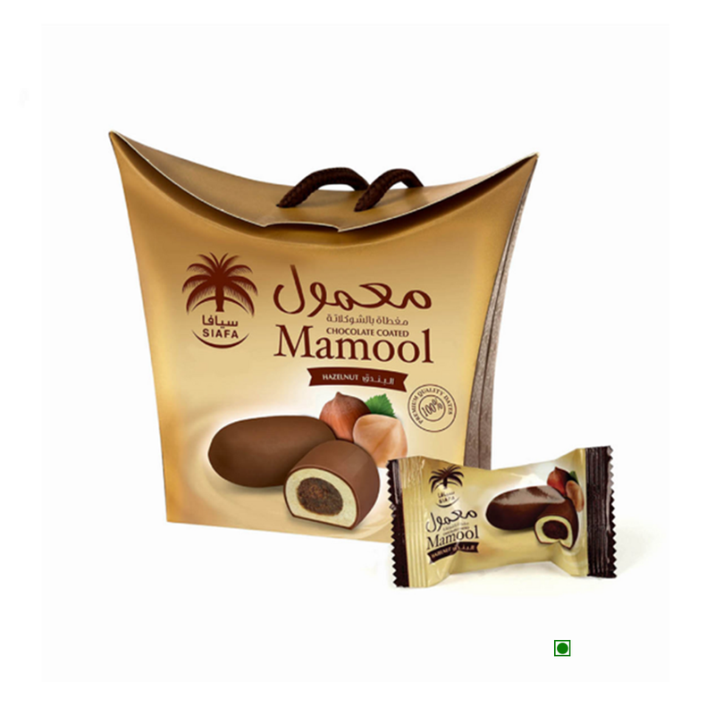 A box of Siafa Dates Mamool Hazelnut 115g from the Kingdom of Saudi with a bag next to it.