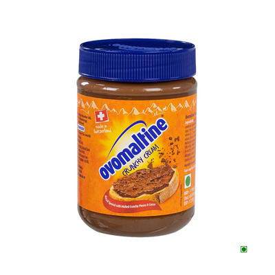 Jar of Ovomaltine Spread Crunchy Cream chocolate bread spread on a white background.