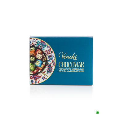 A blue box with a colorful design on it, filled with Venchi Chocoviar Experience 169g and extra dark chocolate.