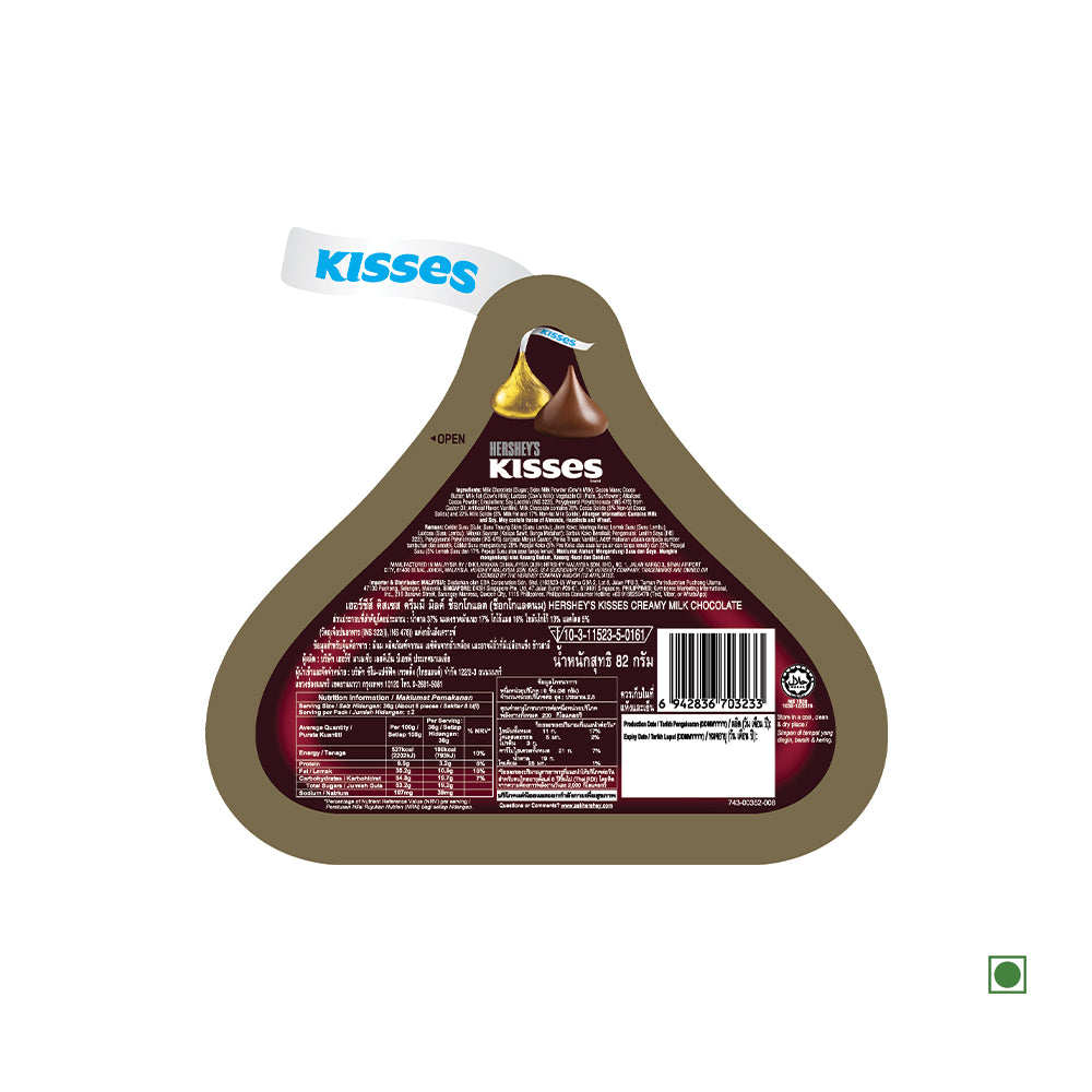 The Hershey's Kisses Milk Chocolate Pouch 82g, perfect for any chocolate lover, features a triangular-shaped package that clearly displays nutritional information and product details with labeling in multiple languages. Enjoy the delight of creamy milk chocolate wrapped in every piece from Hershey's!