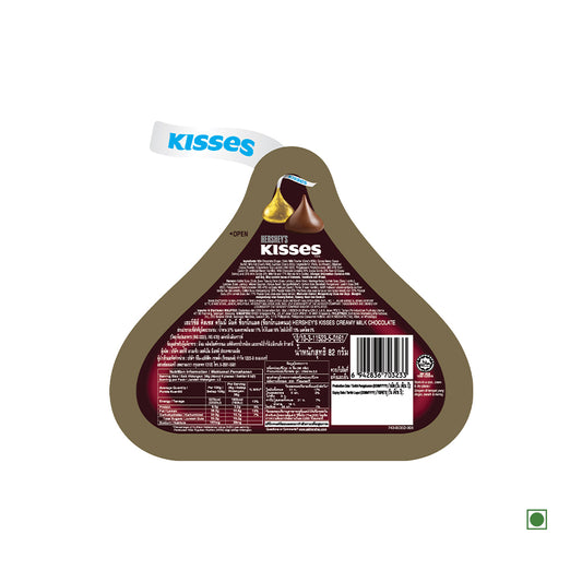 A triangular container of Hersheys Hershey's Kisses Milk Chocolate Pouch 82g for the chocolate lover, filled with creamy milk chocolate and featuring ingredients and nutritional information printed on the back.