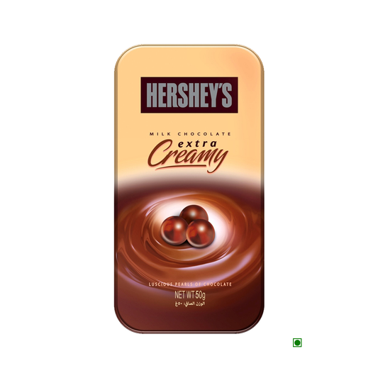 A rectangular package of Hersheys Hershey's Extra Creamy Milk Chocolate Pearls 50g, displaying three chocolate pieces on a swirling background. Enjoy the smooth and creamy chocolate that promises an unforgettable taste.