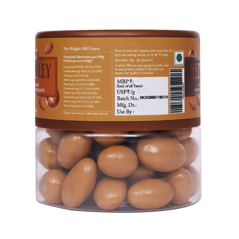 Clear plastic jar of Rhine Valley Almond & Hazelnut Blonde Dragees 100g with detailed nutritional and product information labels visible around it.